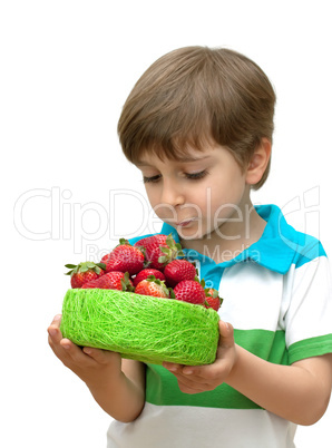 Portrait of a boy with a bowl of strawberries in the hands isolated on white background