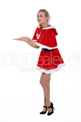 Miss Santa holding empty copyspace