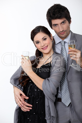 Glamorous couple drinking champagne