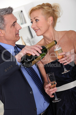 Mature couple drinking champagne