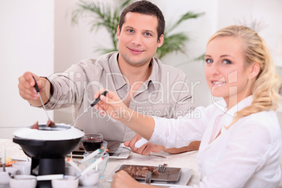Couple enjoying a chocolate fondue