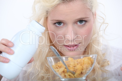 Blond woman with bowl of cereal