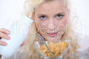 Blond woman with bowl of cereal