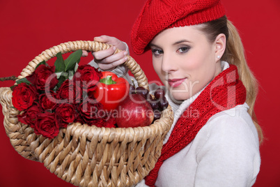 lovely blonde carrying basket filled with red and dressed to match