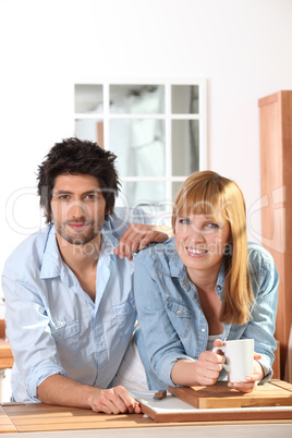 Couple having a coffee in a kitchen