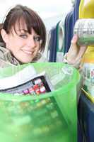 Woman placing trash in recycle bin