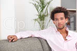 Boy sitting on sofa