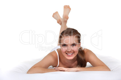 Young woman laying on bed