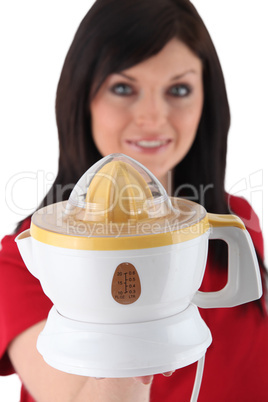 Woman holding electric juicer