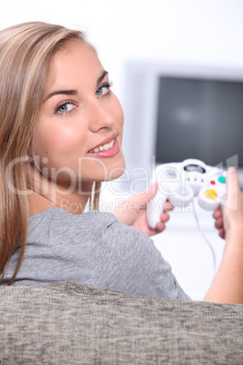 A cute blond playing video games.