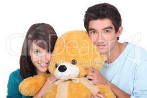 portrait of teenagers with teddy-bear