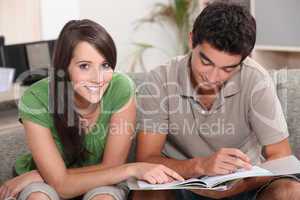 Teenage couple studying