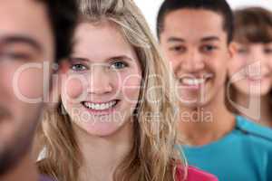 A row of young and smiley people