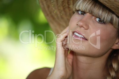 close-up of a woman with straw hat