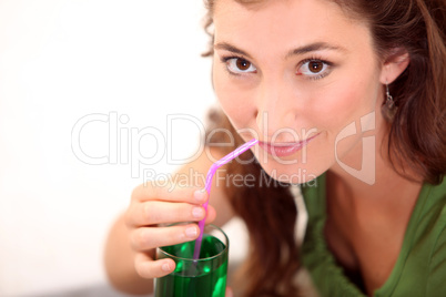 Woman drinking mint drink