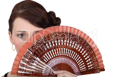 Woman holding fan