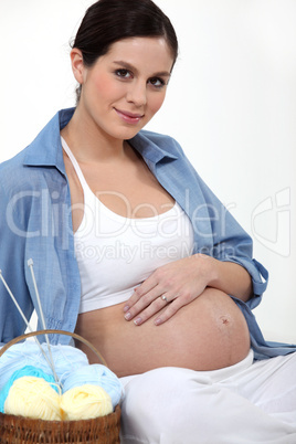 Pregnant woman knitting