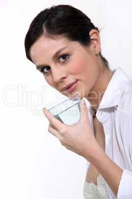 Woman holding glass of water