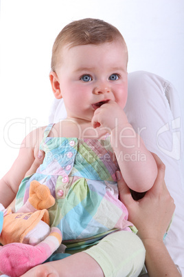 Baby girl held by mother