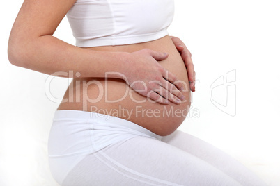 Pregnant woman touching her belly