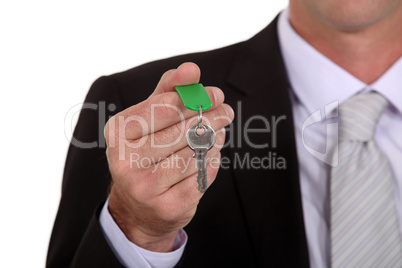 Businessman holding a key