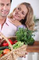 Couple with vegetable basket