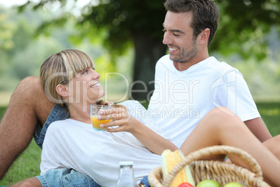 Couple relaxing on the grass