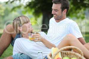 Couple relaxing on the grass