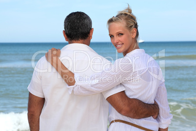 Couple walking by the sea