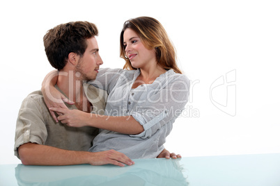 Woman sitting in the lap of her boyfriend