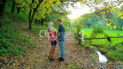 a young couple in the autumn park