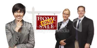 Mixed Race People with Sold Real Estate Sign Isolated