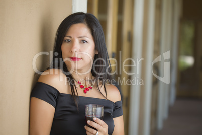 Attractive Hispanic Woman Portrait Outside Enjoying Wine