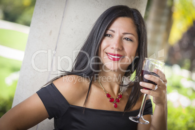 Attractive Hispanic Woman Portrait Outside Enjoying Wine