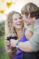 An Attractive Couple Enjoying A Glass Of Wine in the Park