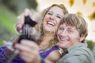 An Attractive Couple Enjoying A Glass Of Wine in the Park