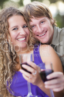 An Attractive Couple Enjoying A Glass Of Wine in the Park