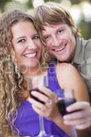 An Attractive Couple Enjoying A Glass Of Wine in the Park