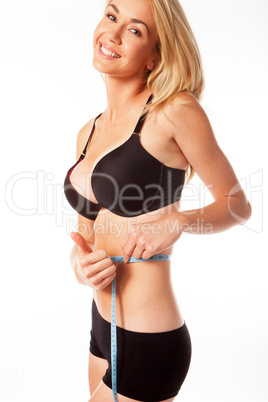 woman measuring her waist