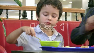 Little boy in fast food restaurant