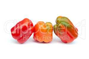 Three sweet peppers on white