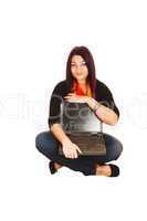 Woman holding laptop.