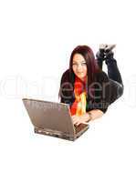 Girl lying on floor with laptop.