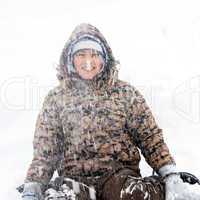 Boy winter portrait at snowfall