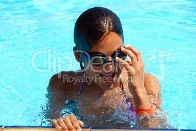 Teen girl in swimming pool portrait