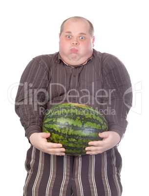 Fat man struggling to hold the weight of a whole watermelon