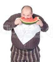 Obese man eating watermelon