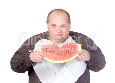 Obese man eating watermelon