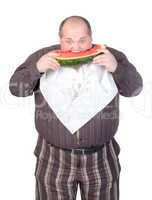 Obese man eating watermelon