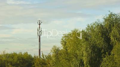 clouds over antenna and trees